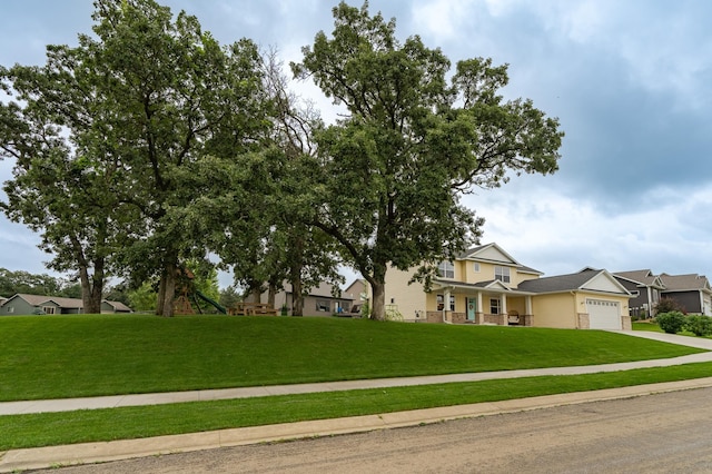 2990 Pinewood Ridge Dr SE, Rochester, MN 55904 - view of front of home with a garage, a front yard, driveway, and a porch
