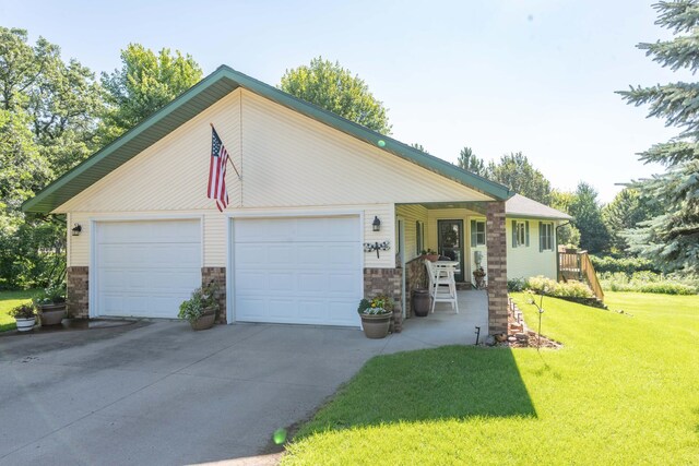 44198 Mosquito Trl, Pine Lake Twp, MN 56573 - view of front of home featuring a front yard, a garage, and stone siding