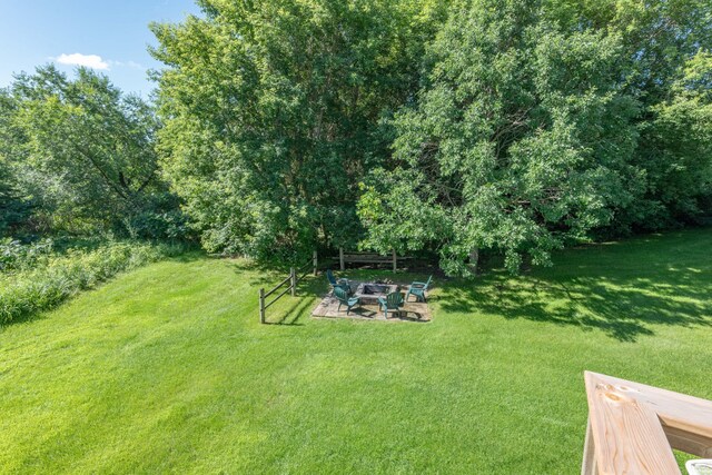 44198 Mosquito Trl, Pine Lake Twp, MN 56573 - view of grassy yard featuring an outdoor fire pit