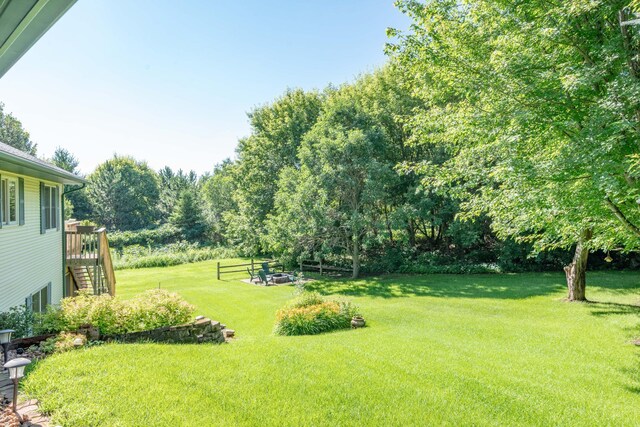 44198 Mosquito Trl, Pine Lake Twp, MN 56573 - view of grassy yard featuring stairs and a deck