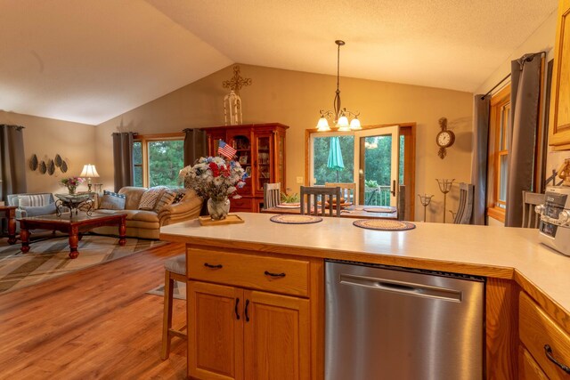 44198 Mosquito Trl, Pine Lake Twp, MN 56573 - kitchen with dishwasher, lofted ceiling, light wood finished floors, light countertops, and open floor plan
