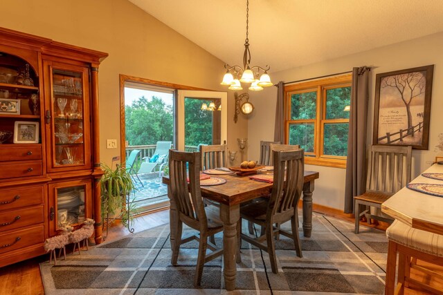 44198 Mosquito Trl, Pine Lake Twp, MN 56573 - dining room featuring a chandelier, lofted ceiling, and dark wood finished floors