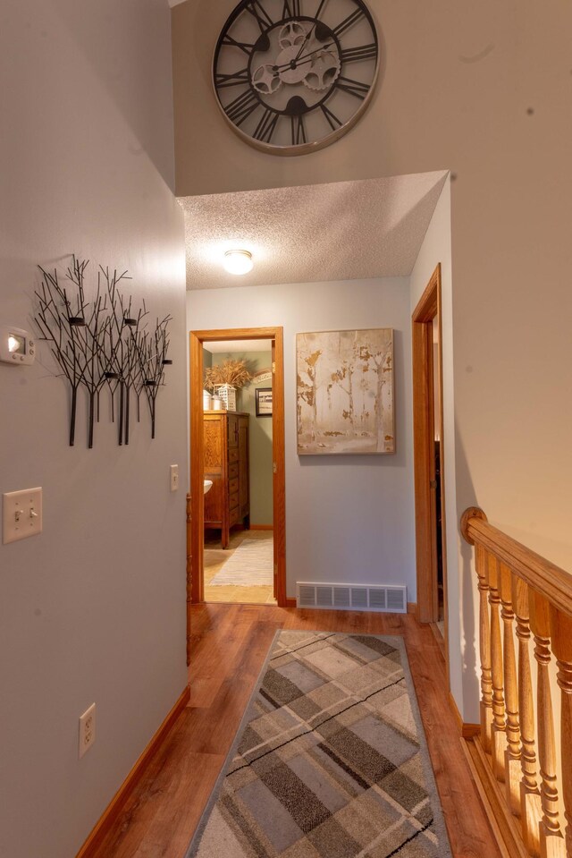 44198 Mosquito Trl, Pine Lake Twp, MN 56573 - hall featuring light wood-style floors and a textured ceiling