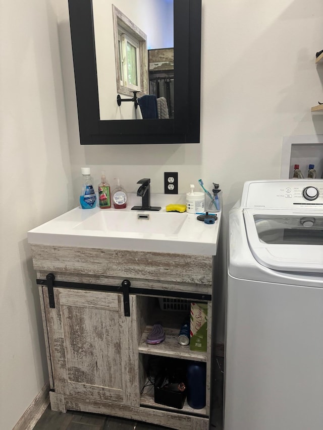119 3rd Ave E, Franklin, MN 55333 - washroom with washer / dryer and wood finished floors