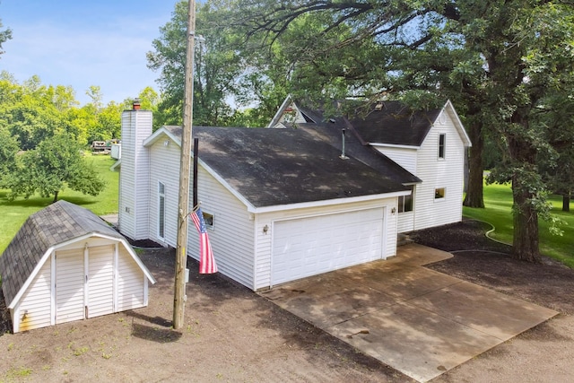 66578 330th St, Watkins, MN 55389 - view of side of property with a storage unit, a chimney, roof with shingles, and a yard