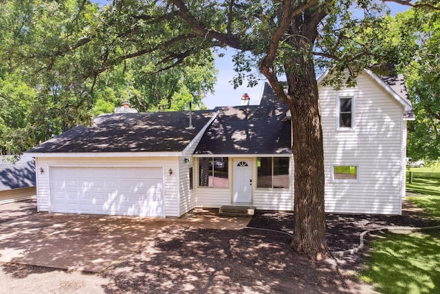 66578 330th St, Watkins, MN 55389 - view of front of property with entry steps, a chimney, driveway, and a garage