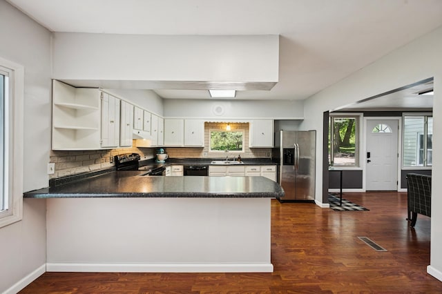 66578 330th St, Watkins, MN 55389 - kitchen with black appliances, dark countertops, a peninsula, open shelves, and plenty of natural light