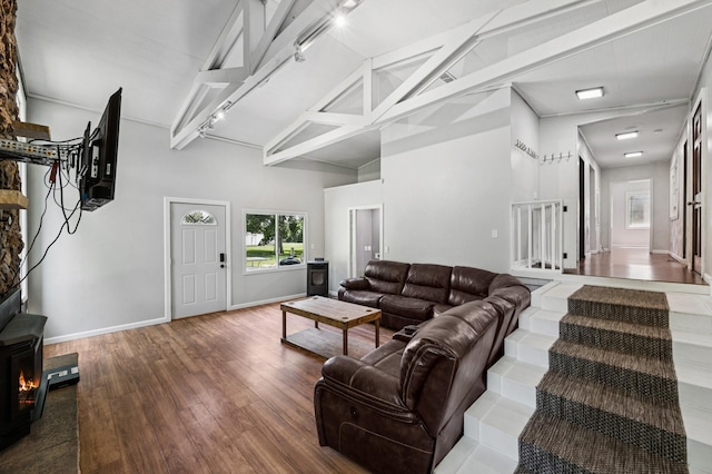 66578 330th St, Watkins, MN 55389 - living area with wood finished floors, beamed ceiling, and high vaulted ceiling