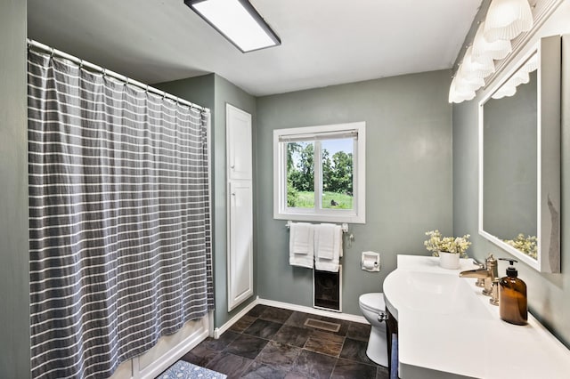 66578 330th St, Watkins, MN 55389 - bathroom featuring vanity, a shower with shower curtain, and stone finish flooring
