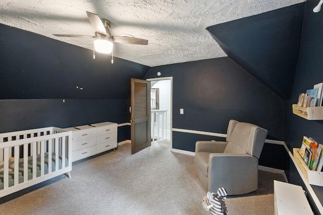 66578 330th St, Watkins, MN 55389 - bedroom with vaulted ceiling, a textured ceiling, carpet floors, a ceiling fan, and a crib