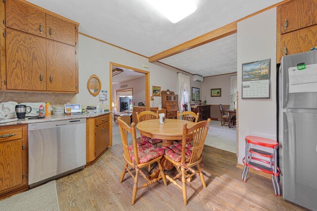 600 168th St, Summit Twp, MN 56026 - dining room with light wood-type flooring, a wall mounted air conditioner, and ornamental molding
