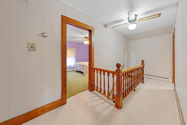 600 168th St, Summit Twp, MN 56026 - hallway with carpet flooring, baseboard heating, and an upstairs landing