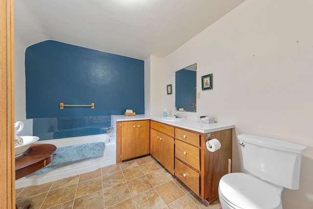 600 168th St, Summit Twp, MN 56026 - bathroom featuring vanity, a bath, and stone finish flooring