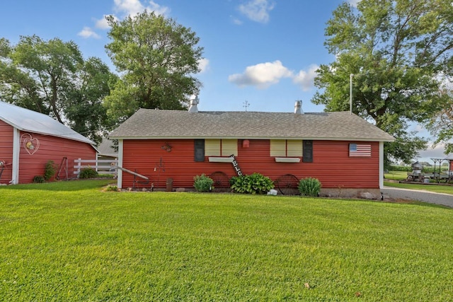 600 168th St, Summit Twp, MN 56026 - view of front of property with a front lawn, a barn, and a shingled roof