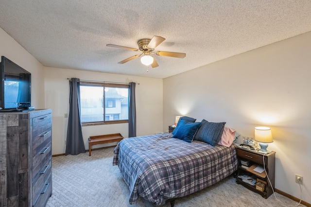8431 Toledo Ave N, Brooklyn Park, MN 55443 - bedroom featuring light carpet, a ceiling fan, and a textured ceiling