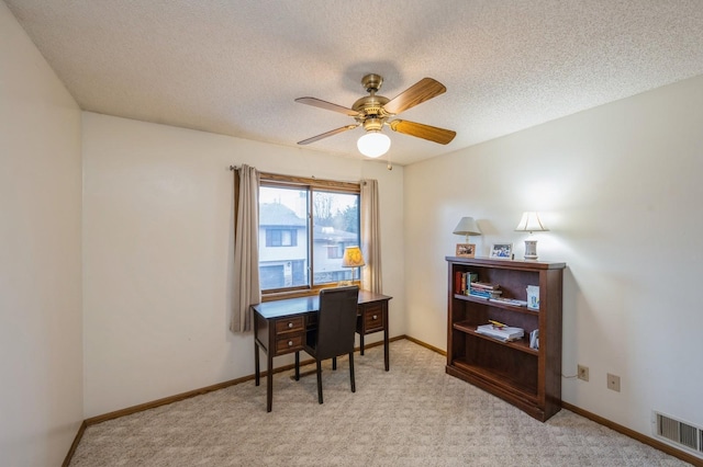 8431 Toledo Ave N, Brooklyn Park, MN 55443 - office area featuring a ceiling fan, a textured ceiling, and light colored carpet