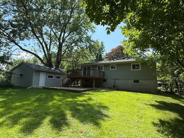 925 Holcombe Ave, Litchfield, MN 55355 - back of house featuring stairway, a wooden deck, and a lawn