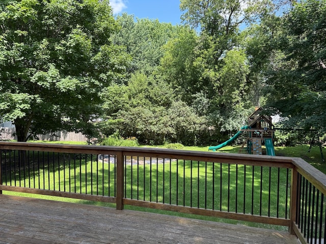 925 Holcombe Ave, Litchfield, MN 55355 - wooden deck featuring a lawn and a playground