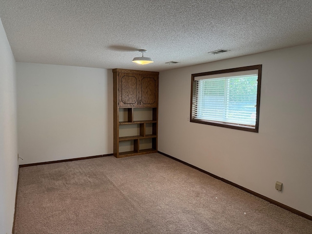 925 Holcombe Ave, Litchfield, MN 55355 - empty room with light colored carpet and a textured ceiling