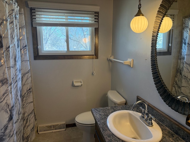 925 Holcombe Ave, Litchfield, MN 55355 - bathroom with healthy amount of natural light, vanity, a shower with shower curtain, and tile patterned flooring
