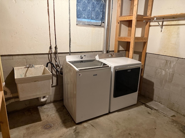 925 Holcombe Ave, Litchfield, MN 55355 - laundry room featuring independent washer and dryer, a wainscoted wall, and concrete block wall
