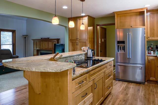 12310 Grouse St NW, Coon Rapids, MN 55448 - kitchen featuring high end refrigerator, black electric stovetop, light wood-style flooring, open floor plan, and recessed lighting