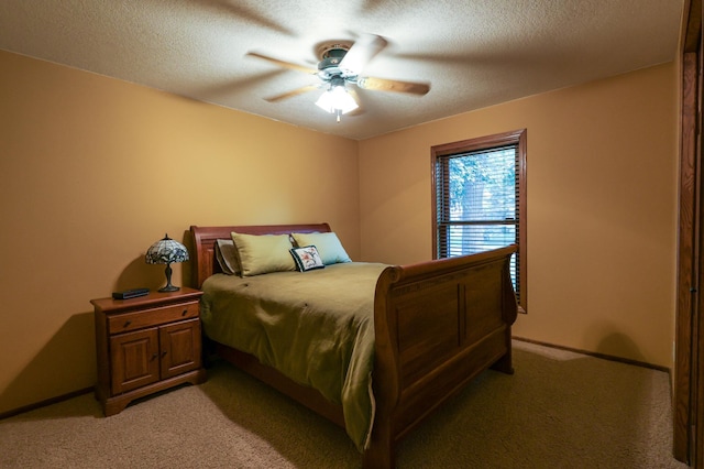 12310 Grouse St NW, Coon Rapids, MN 55448 - bedroom featuring light colored carpet, ceiling fan, and a textured ceiling