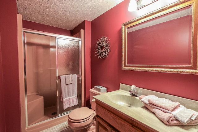 12310 Grouse St NW, Coon Rapids, MN 55448 - bathroom with a stall shower, vanity, a textured ceiling, and tile patterned flooring