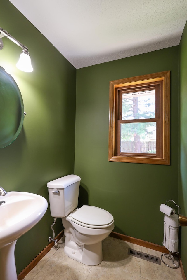 12310 Grouse St NW, Coon Rapids, MN 55448 - bathroom with baseboards and tile patterned floors
