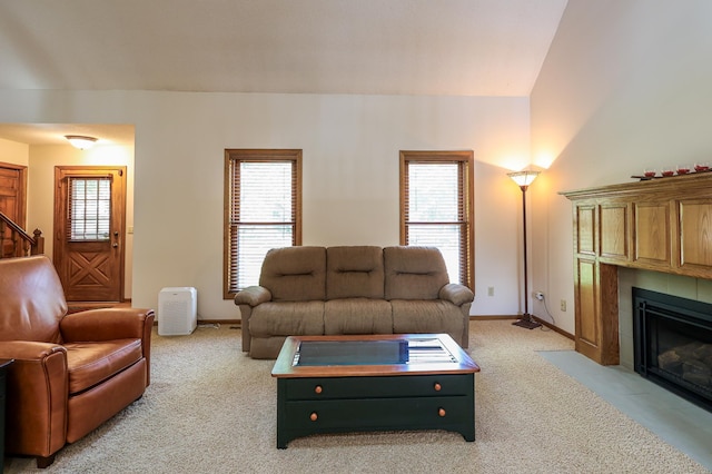 12310 Grouse St NW, Coon Rapids, MN 55448 - living area featuring light colored carpet, a fireplace, and healthy amount of natural light