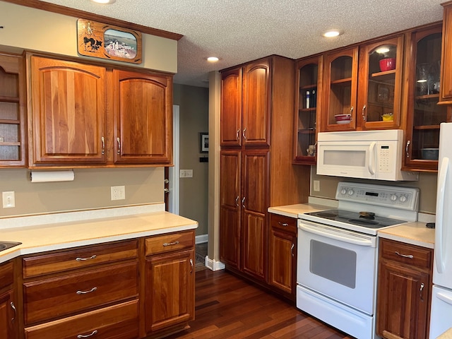 1010 Oakwood Ave, Benson, MN 56215 - kitchen featuring white appliances, dark wood-style floors, light countertops, recessed lighting, and a textured ceiling