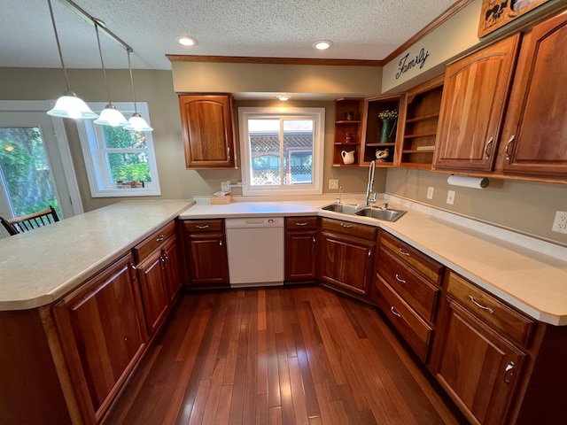 1010 Oakwood Ave, Benson, MN 56215 - kitchen featuring white dishwasher, a peninsula, light countertops, and a textured ceiling
