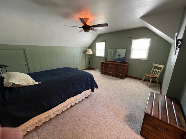1010 Oakwood Ave, Benson, MN 56215 - bedroom with vaulted ceiling, carpet floors, and a ceiling fan