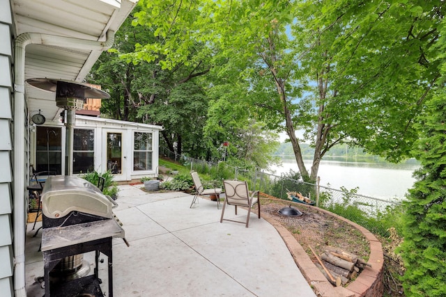 1060 Greer Ave NW, Albion Twp, MN 55358 - view of patio with a water view and grilling area