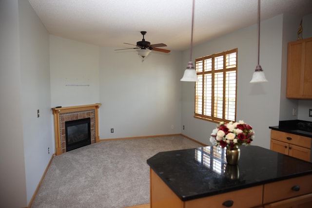 2690 Pinkspire Ln E, Maplewood, MN 55119 - kitchen featuring dark countertops, light carpet, open floor plan, a fireplace, and a ceiling fan