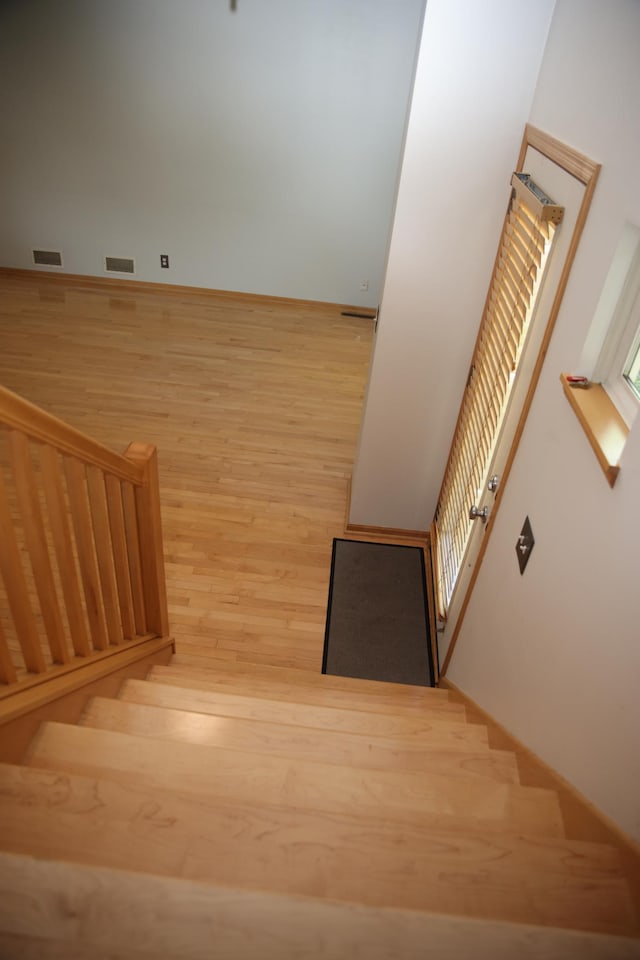 2690 Pinkspire Ln E, Maplewood, MN 55119 - staircase with wood finished floors