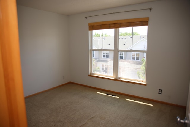 2690 Pinkspire Ln E, Maplewood, MN 55119 - spare room with carpet flooring and baseboards