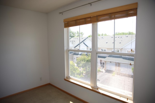 2690 Pinkspire Ln E, Maplewood, MN 55119 - empty room featuring carpet and baseboards
