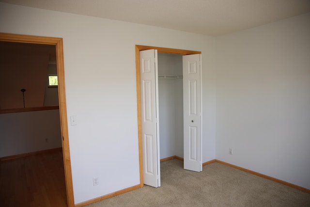 2690 Pinkspire Ln E, Maplewood, MN 55119 - unfurnished bedroom featuring a closet and carpet floors