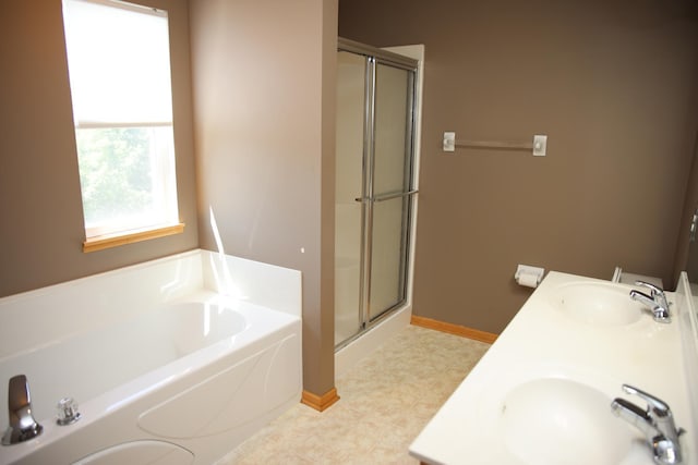 2690 Pinkspire Ln E, Maplewood, MN 55119 - bathroom featuring a stall shower, a bath, and double vanity