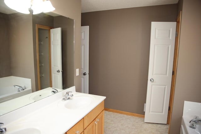 2690 Pinkspire Ln E, Maplewood, MN 55119 - bathroom featuring a garden tub, double vanity, and tile patterned floors