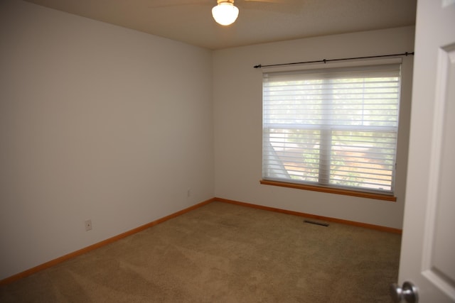 2690 Pinkspire Ln E, Maplewood, MN 55119 - carpeted empty room featuring ceiling fan and baseboards