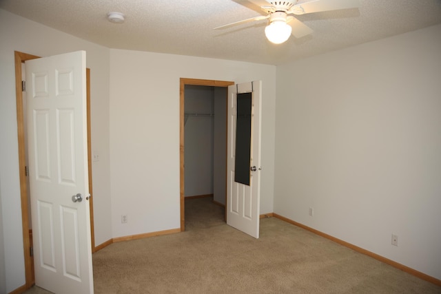 2690 Pinkspire Ln E, Maplewood, MN 55119 - unfurnished bedroom with light colored carpet, a spacious closet, and ceiling fan