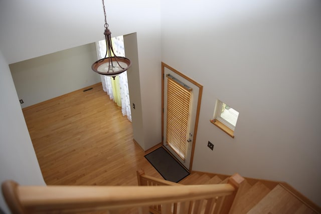 2690 Pinkspire Ln E, Maplewood, MN 55119 - stairway featuring wood finished floors