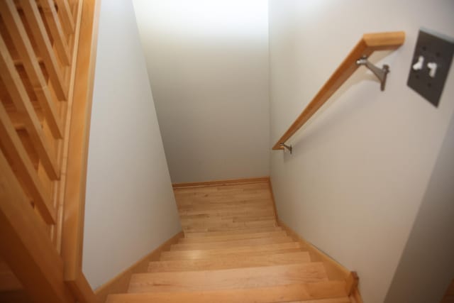2690 Pinkspire Ln E, Maplewood, MN 55119 - staircase with wood finished floors