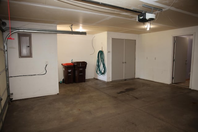 2690 Pinkspire Ln E, Maplewood, MN 55119 - garage featuring electric panel and a garage door opener
