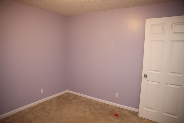 2690 Pinkspire Ln E, Maplewood, MN 55119 - unfurnished room with carpet floors and a textured ceiling