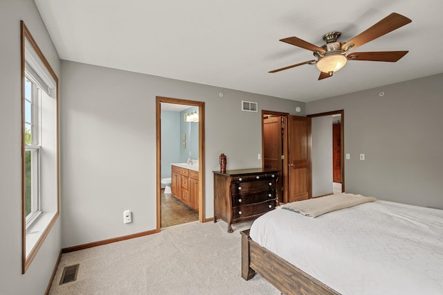 8291 Labont Way, Eden Prairie, MN 55344 - bedroom with light colored carpet, ensuite bath, and a ceiling fan