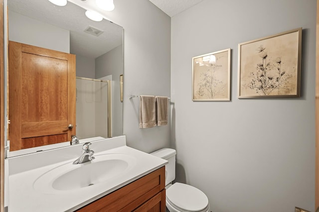 8291 Labont Way, Eden Prairie, MN 55344 - bathroom with vanity, a textured ceiling, and an enclosed shower