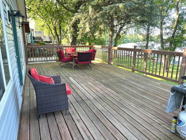 10285 237th Ave, Spirit Lake, IA 51360 - wooden terrace featuring outdoor dining space